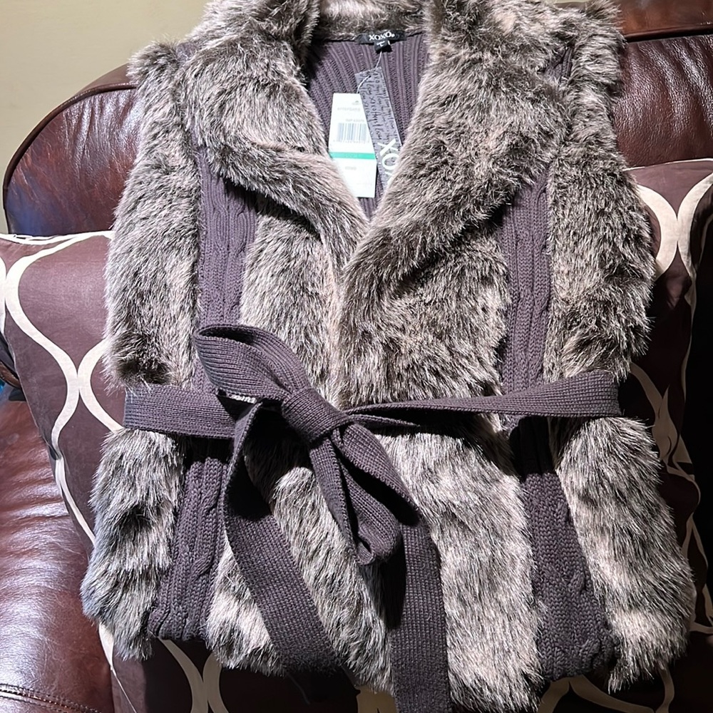A beautiful faux fur belted vest